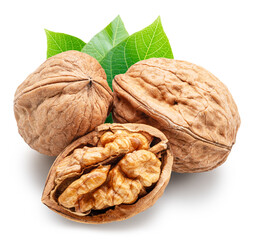 Whole walnuts and split walnut with kernel inside it isolated on white background. Clipping path.