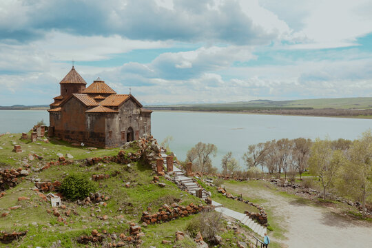 Sevanavank Monastery overlooking Lake Sevan in Armenia during a bright cloudy day