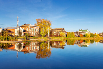 Fototapeta premium Bogorodsk, Nizhny Novgorod region, Russia, Street view of an ancient provincial Russian city on the shore of a lake on a summer evening. An ancient building of artisans, an architectural monument.
