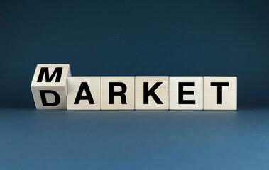 Wooden blocks spelling out the words Market and Darket