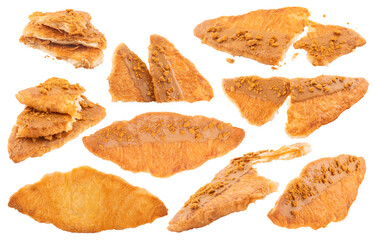 Set of flat and crispy croissants with caramel sauce and cookie crumbs topping, clipping path included