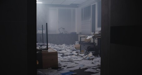 Bank robbery at night or murder case: Papers and office equipment scattered at crime scene....