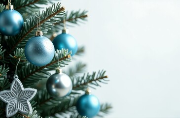Beautiful green New Year's tree, branches covered with frost with blue and silver New Year's toys on a white background