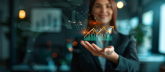 A confident businesswoman shows a holographic growth chart in a modern office, symbolizing success and innovation. The scene reflects a corporate environment focused on technology and future growth