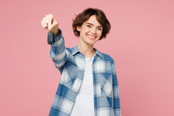 Young woman she wear blue shirt white t-shirt casual clothes hold in hand give car key fob keyless...
