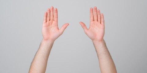 Hands raised in celebration against a light gray background.