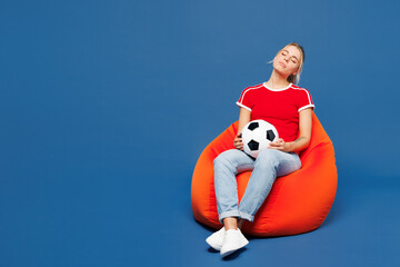 Full body young dissatisfied displeased woman fan in red t-shirt cheer up support football sport...