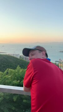 Traveler enjoys sunset while admiring the sights.