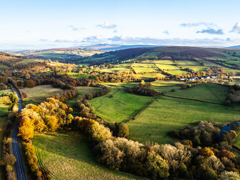 Farms over Trecastle from a drone at sunset, Brecon Beacons National Park, Powys, Wales, England