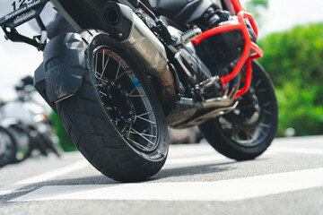 Motorcycle cruising down the road under the golden sunset, basking in the warm glow. A perfect...