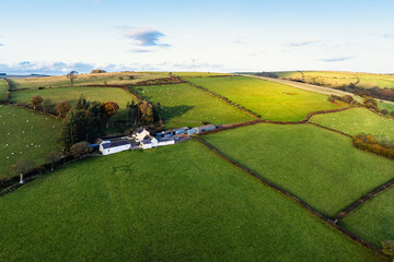 Obraz premium Farms over Trecastle from a drone at sunset, Brecon Beacons National Park, Powys, Wales, England