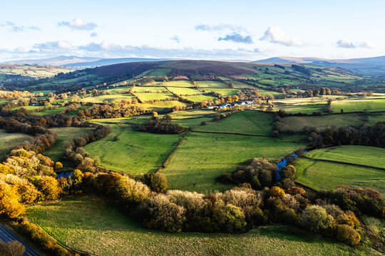 Farms over Trecastle from a drone at sunset, Brecon Beacons National Park, Powys, Wales, England