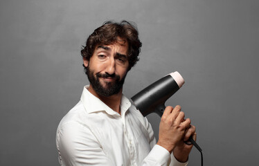 young adult man with a hair dryer