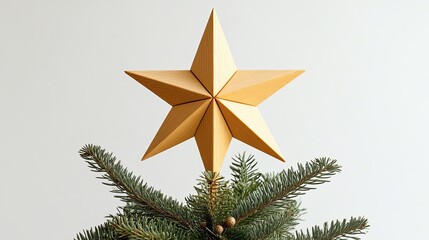 A stylish golden star tree topper on a Christmas tree, featuring a minimalist design against a light background.