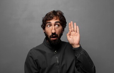 Fototapeta premium looking serious and curious, listening, trying to hear a secret conversation or gossip, eavesdropping