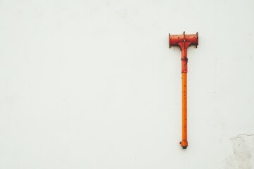 Bright Orange Tool Against Plain White Background