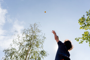 low shot professional tennis court young curly guy technically performs the first serve in the game examines it clay court markings