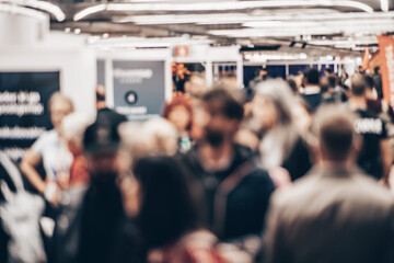 Abstract blurred people at exhibition hall of expo event trade show. Business convention show or job fair. Business concept background