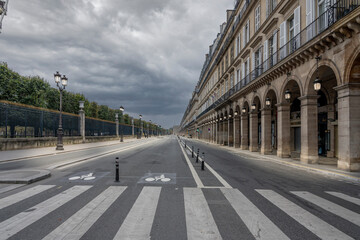 Fototapeta premium Paris, France - 11 01 2024: View of Rivoli Street at sunset with few people.