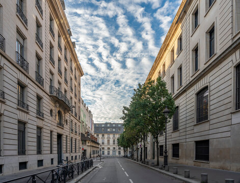 Paris, France - 10 28 2024: View of a typical street with buildings and a zebra sky  .