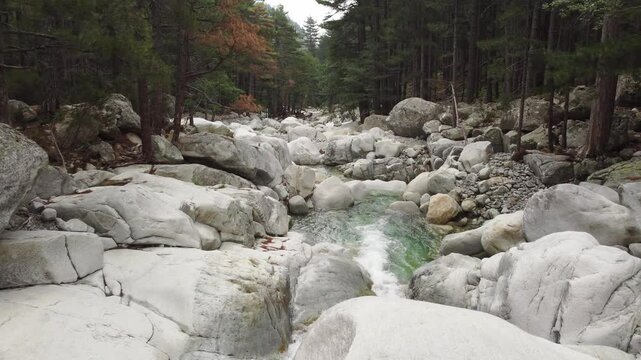 Low aerial shot of wonderful river stream with waterfalls in Restonica Valley