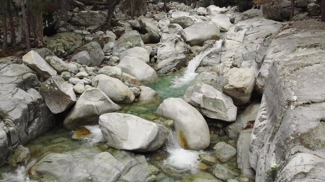 Restonica Valley swimming spots, peaceful creek stream flowing through rocks