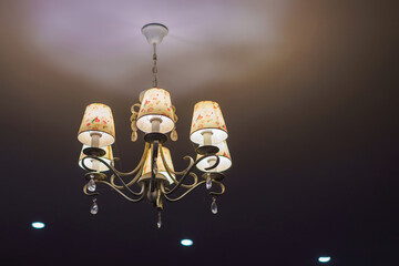 Modern beautiful golden chandelier ceiling lamp light bulb from glass antique style interior in...
