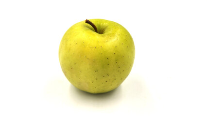 A golden delicious apple isolated on white background
