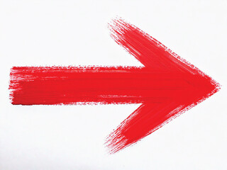 A vibrant red arrow painted with brush strokes pointing to the right.