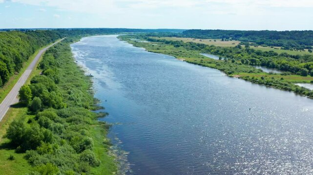 Nemunas, the largest river in Lithuania. Road near the river. The landscape of Lithuania on summer day. Lithuania - 2024 Aug 15. 