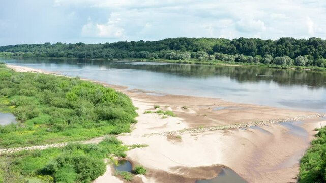 Nemunas, the largest river in Lithuania. Sandy coast. The landscape of Lithuania on summer day. Lithuania - 2024 Aug 15. 