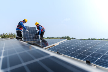 Male workers repair Floating solar panels on water lake. Engineers construct on site Floating solar...
