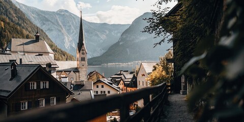 Fototapeta premium Scenic Mountain Village with Church and Lake