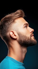 Fototapeta premium A man with a shaved head and a beard is looking up at the camera