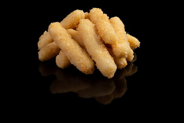 Cheese sticks on a black background.