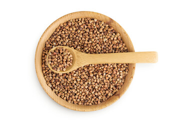 Raw buckwheat in wooden bowl isolated on white background. Top view. Flat lay