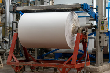 Fabric batching process machine industrial plant line in a textile factory.