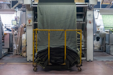 Fabric batching process machine industrial plant line in a textile factory.