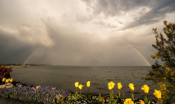 Dramatic skies and double rainbows over Lake Geneva, Switzerland