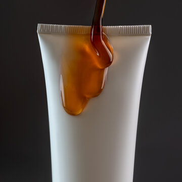 Cosmetic tube with dripping caramel-like substance