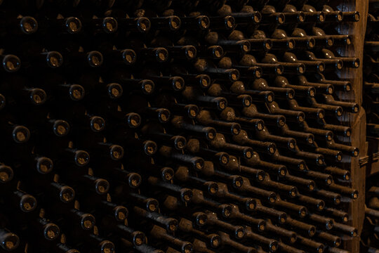 Aged wine bottles in a traditional Kakheti cellar