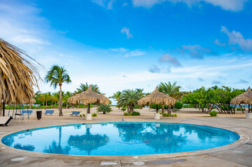 swimming pool with sun loungers