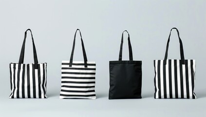 Five unique black and white striped tote bags in various sizes