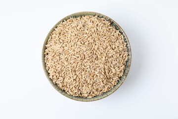 Oat grains in bowl isolated on white, top view