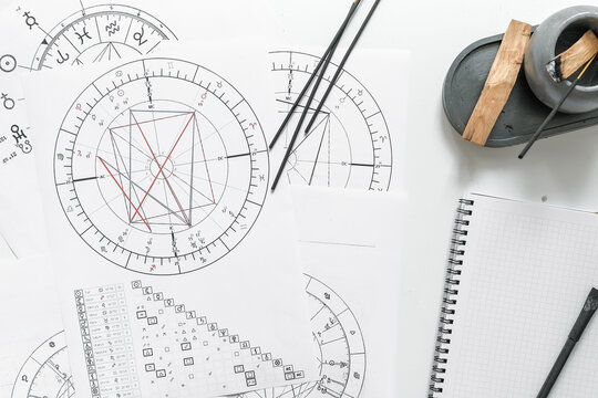 Astrology. Astrologer calculates natal chart and makes a forecast of fate Tarot cards, Fortune telling on tarot cards magic crystal, occultism, Esoteric background. Fortune telling,tarot predictions