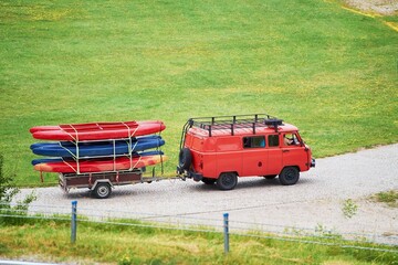 Vehicle transporting kayaks on a trailer