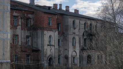 Old abandoned, partially ruined brick building on the outskirts of Krasnofarforny, Leningrad...