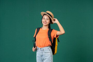 On her vacation, the Asian female tourist took a break from sightseeing to do a studio photoshoot, looking fabulous in her wide-brimmed hat and designer bag, capturing memories to cherish forever.