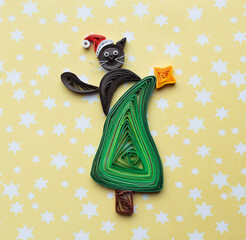 Christmas card, Paper cat on  Christmas tree with star and stars, hand made. a naughty cat climbing...