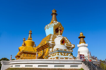 View of 9 Gold Pillars near Palyul Namdroling Temple in Bodh Gaya, Bihar, India.